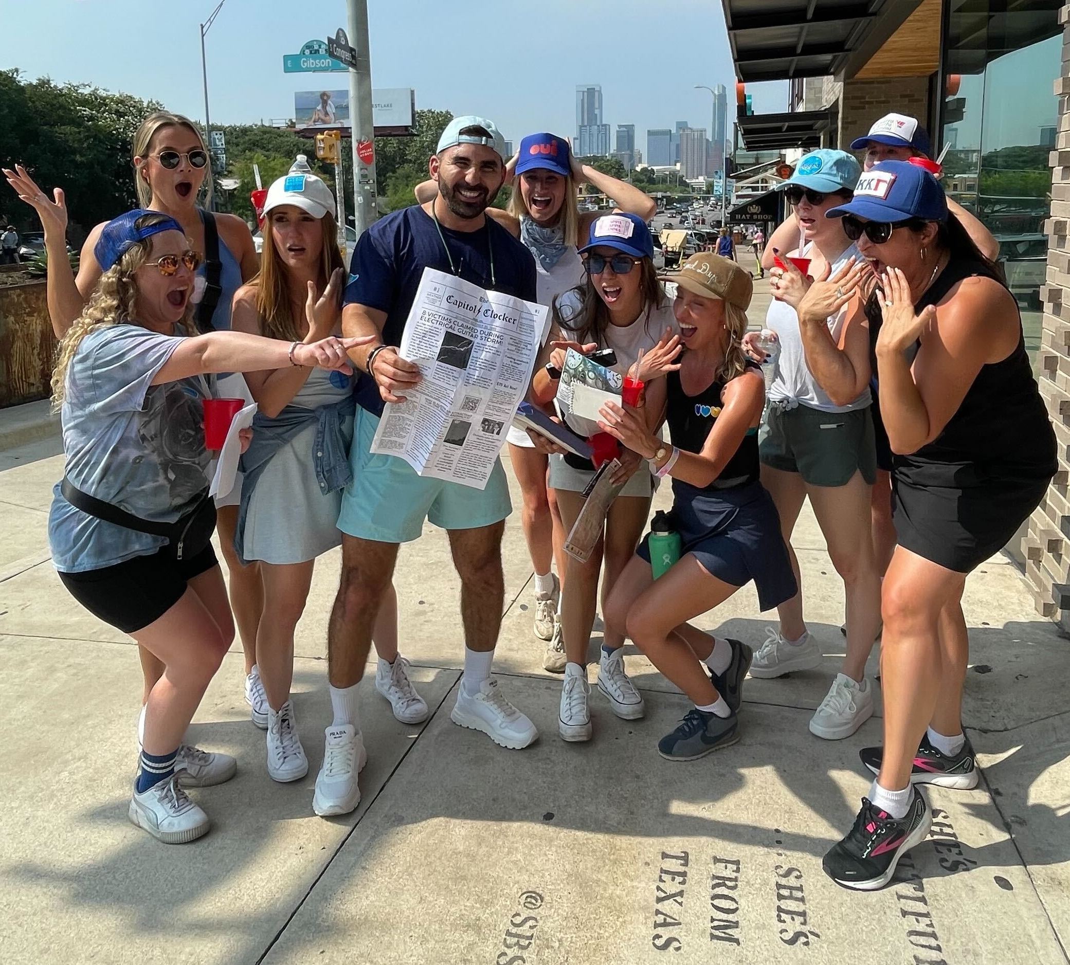 Teams solving puzzles during Escape the Box outdoor escape game team building event in downtown Austin