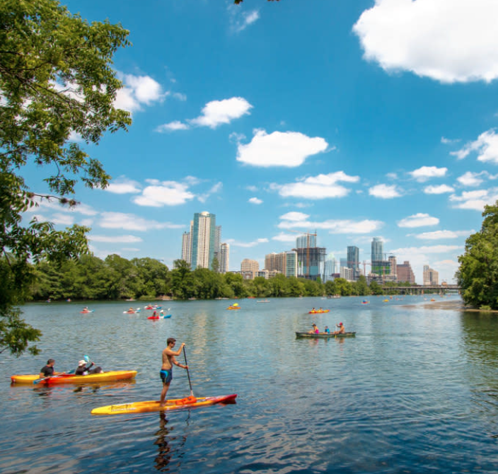 Corporate team kayaking together on Lady Bird Lake in Austin Texas